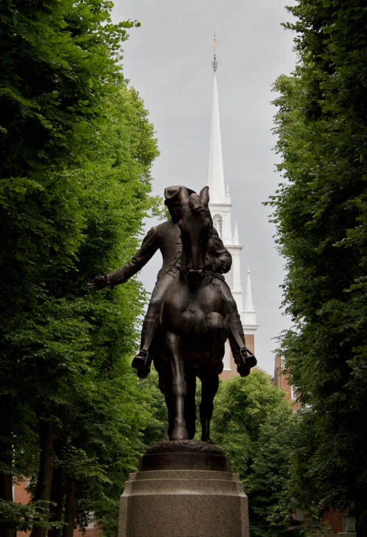 a statue of a man riding on a horse