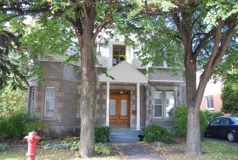 a house with a fire hydrant in front