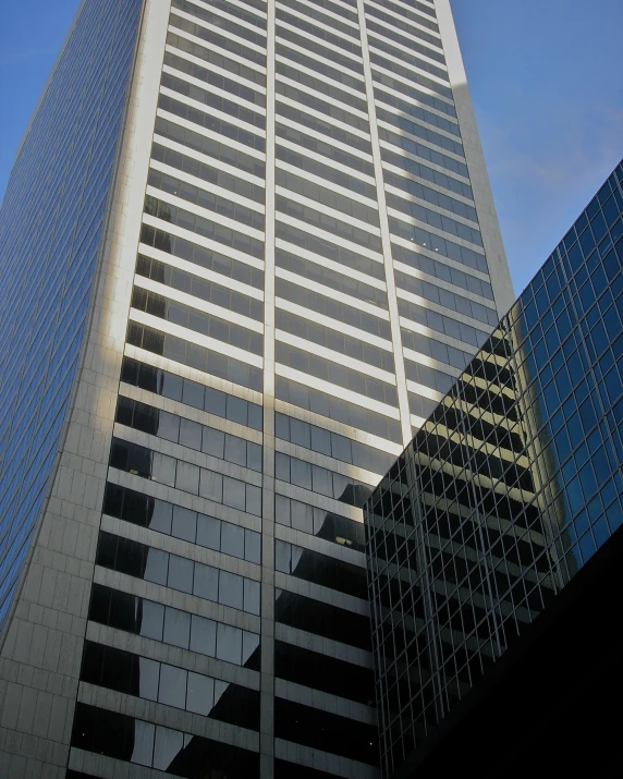 the side of a tall office building with several windows