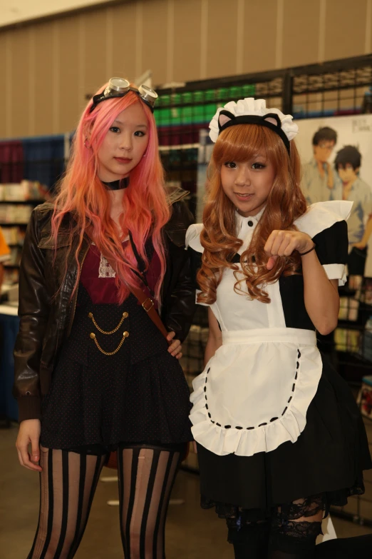 two girls dressed in costumes posing for the camera