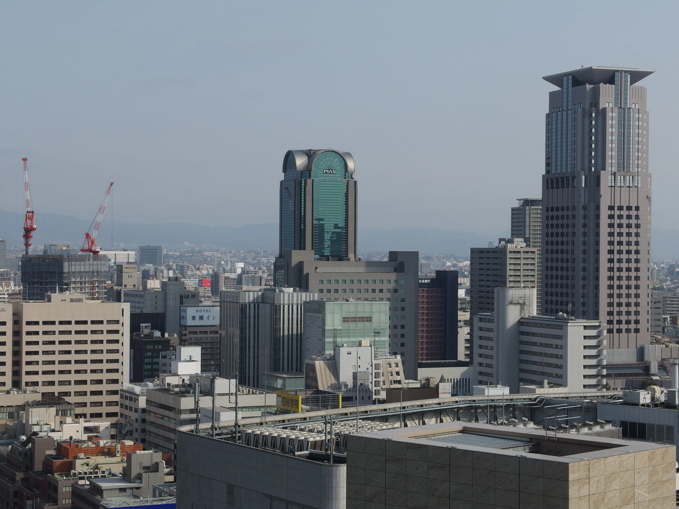 cityscape view of skyscrs and other high rises in the distance