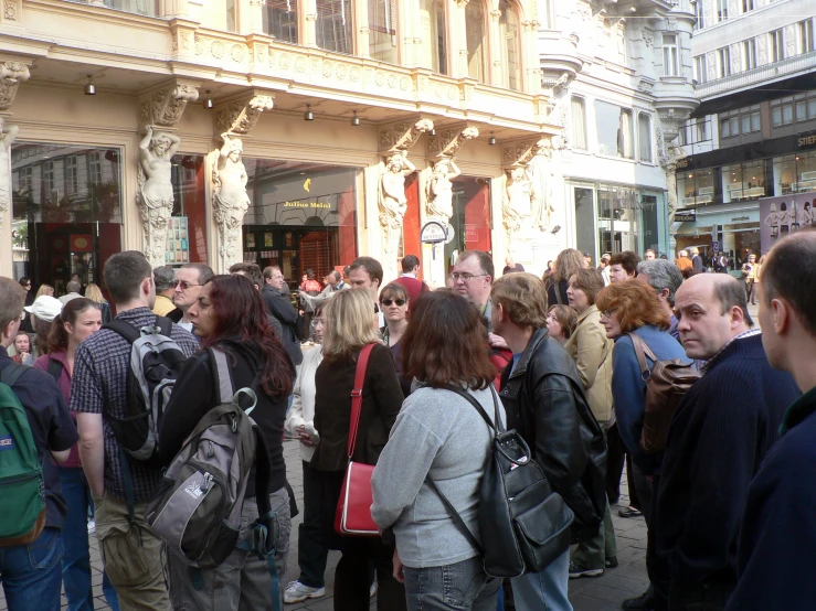 people standing on the street during a day in town