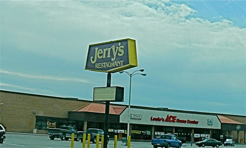 a tekts restaurant sign over a parking lot