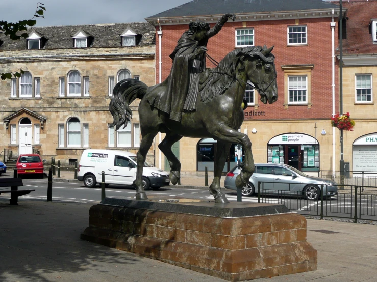 a statue of a man on a horse with a rider