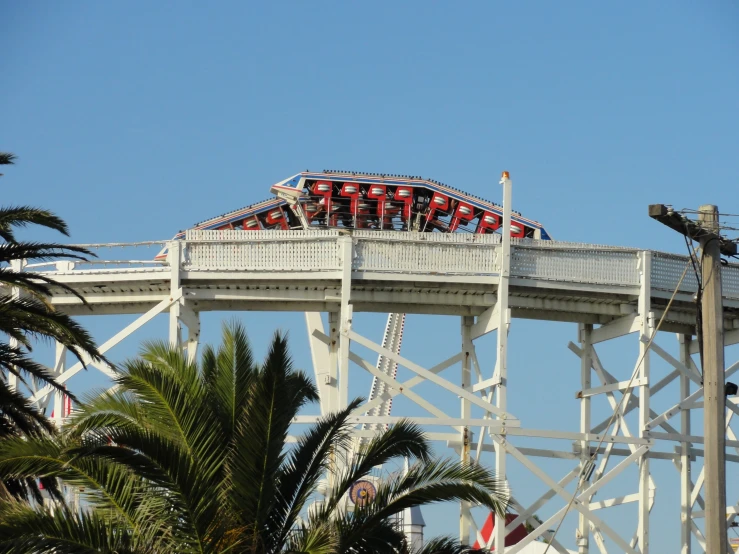 a roller coaster with a red and white striped seat belt