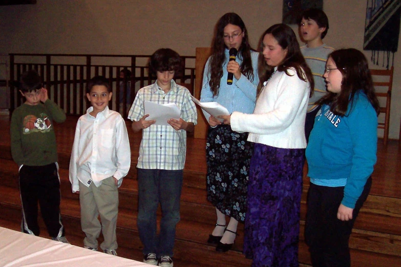 an image of children reading to an adult