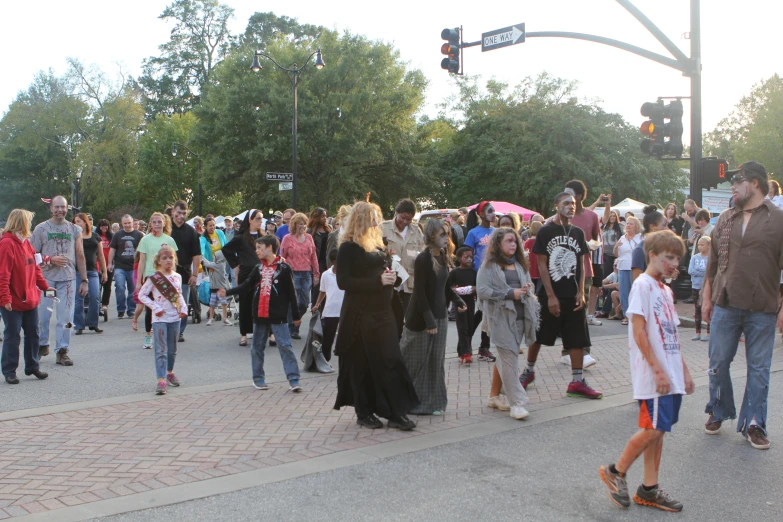 a crowd of people walking on the street