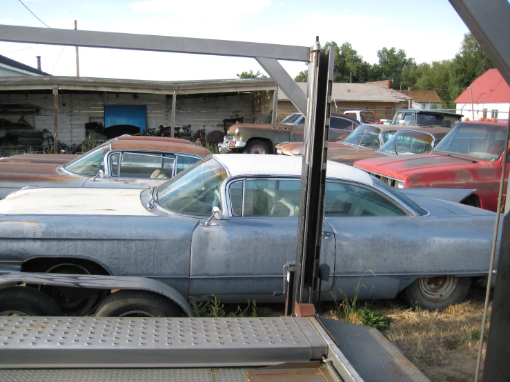 a view from outside an old car dealership