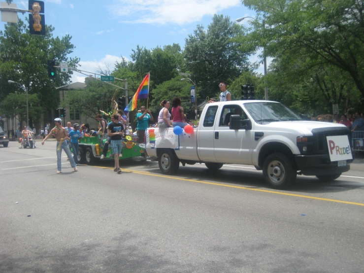 a truck with a float traveling down the street