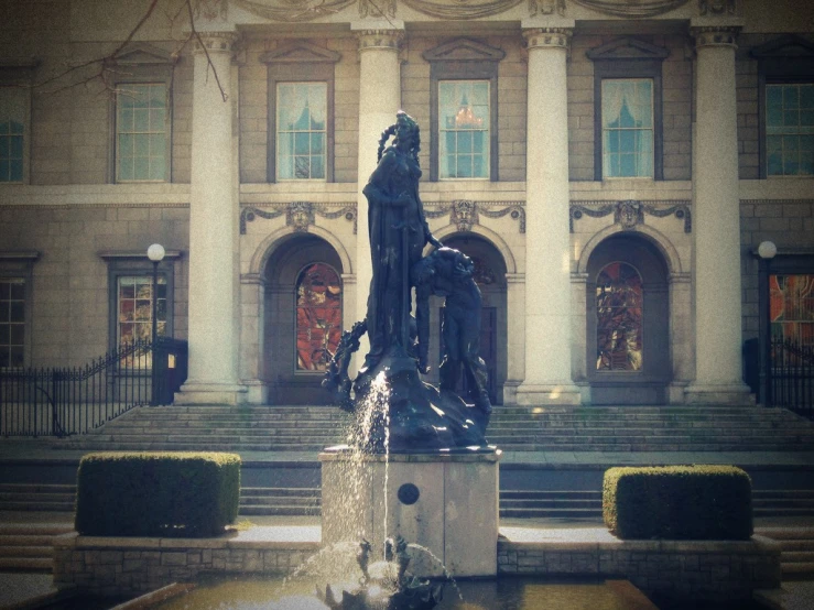 a fountain outside of a very old building