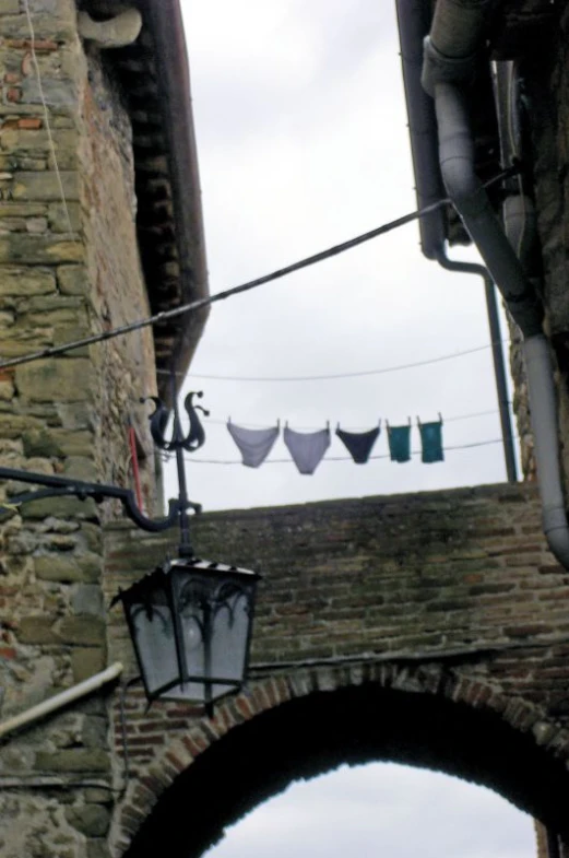 clothes hanging on the line between two buildings