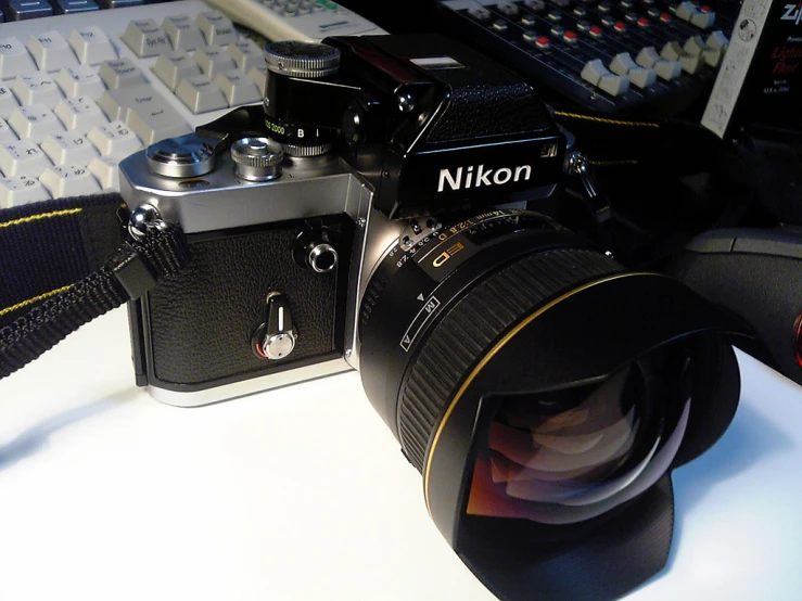 a camera on the counter next to the keyboard