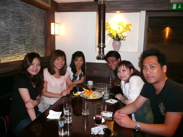 a group of people sitting at a table