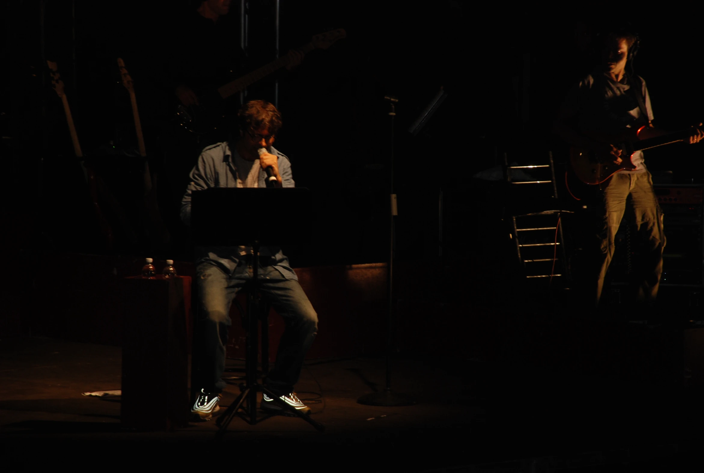 a man with his feet up in front of him on a stool