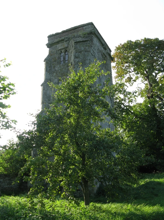 a very tall tower on top of a hill