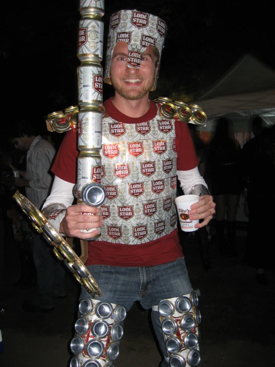man dressed in costume carrying a giant metal object