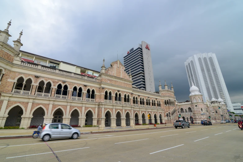 an old building is situated near tall buildings