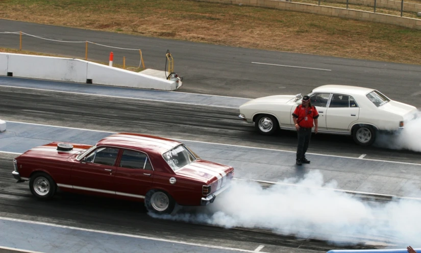 a person on the back of a car smoking a cigarette