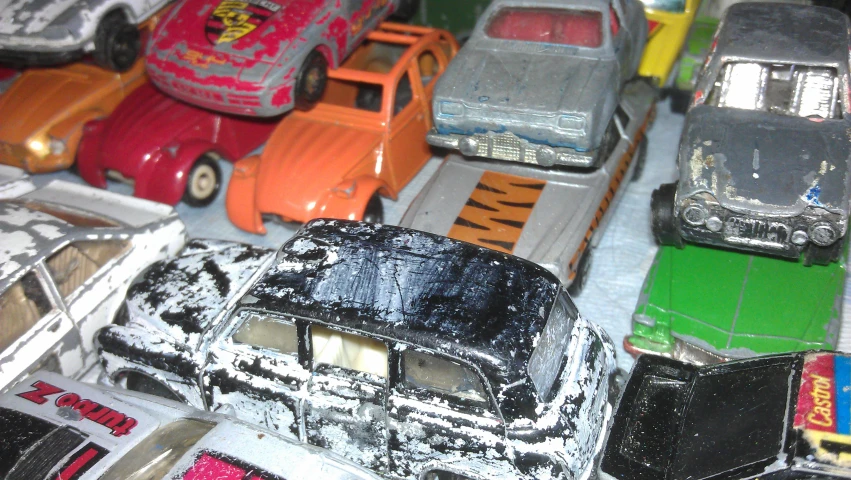 several different types of toy cars are on display