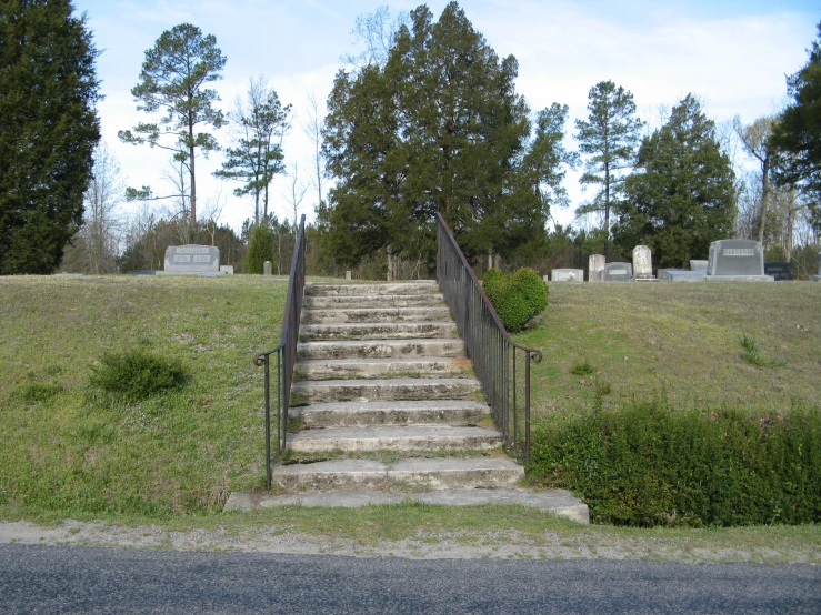 a bunch of steps that are near a graveyard