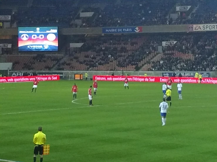 a group of men playing a game of soccer