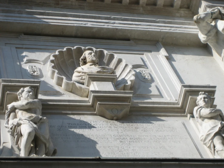 an intricate architecture detail with statues in the center