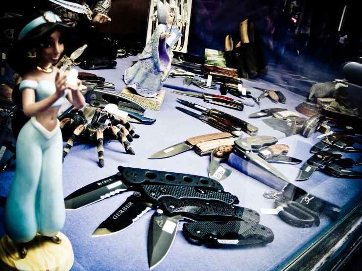 a bunch of knifes on display on a table