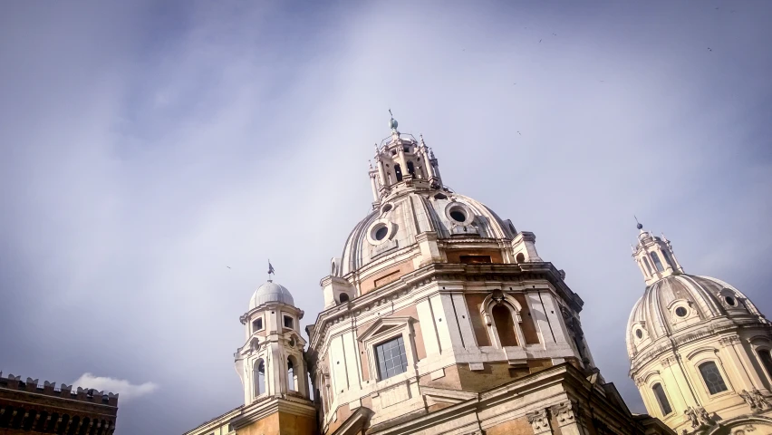 a big building with some steeples against a blue sky