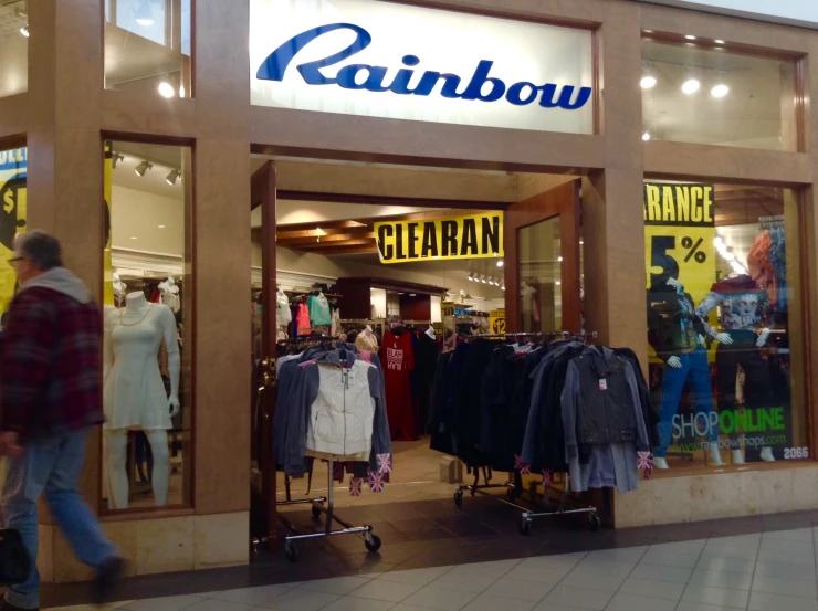 a retail store with lots of shirts on display