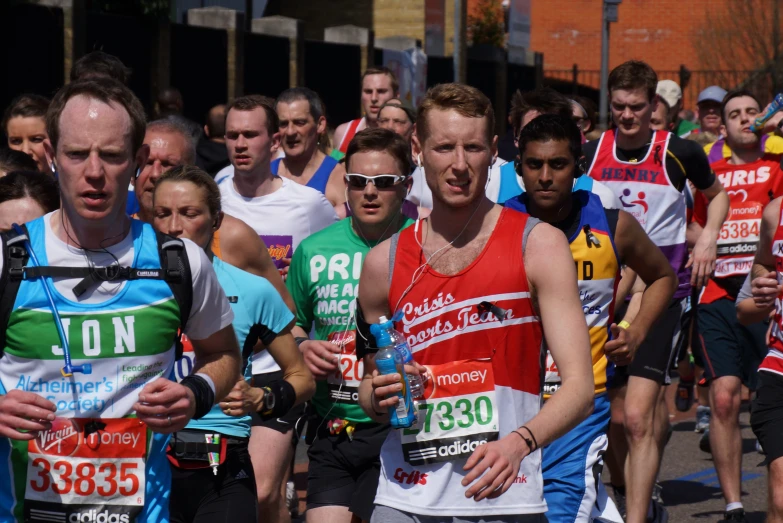 people running in a race with a lot of signs