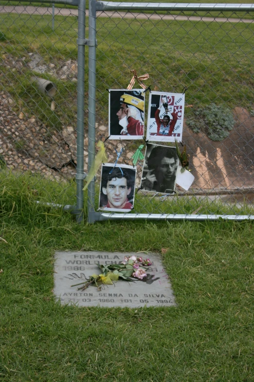 an old cemetary with portraits of elvis presley, flowers and notes