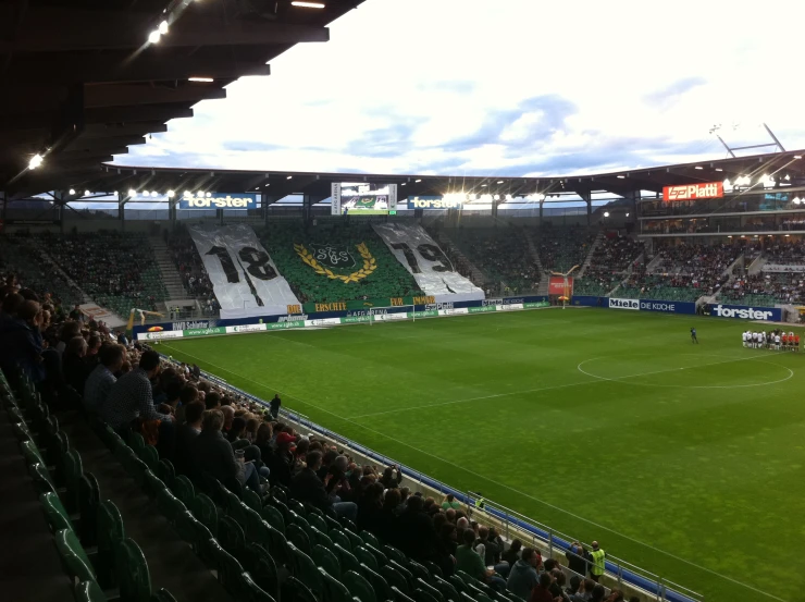 a very large soccer field is empty of people