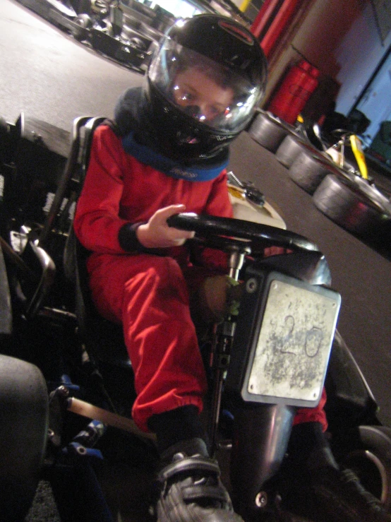 a man riding on the back of a motorcycle wearing a helmet