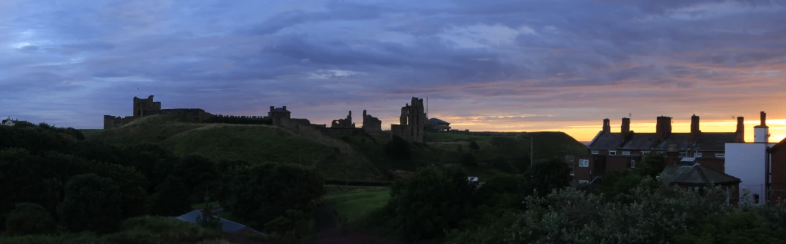 a castle is shown sitting atop a hill