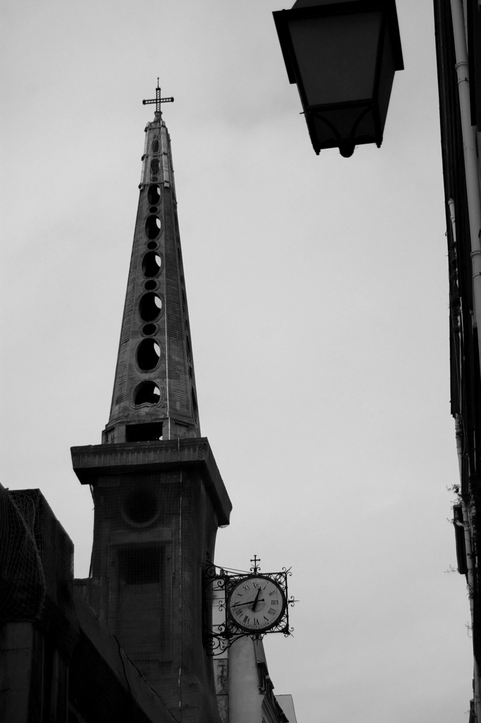 a church steeple with a clock mounted on it