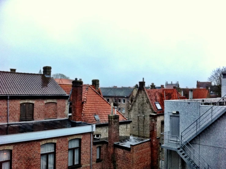 old brick buildings in an area with windows and balconies