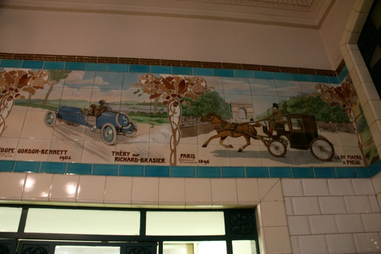 a tiled wall decorated with images and words