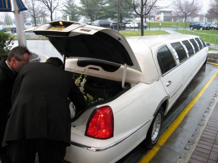 a wedding limousine has its hatch open