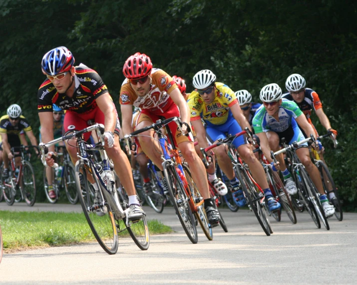 a bunch of people riding on the backs of bikes