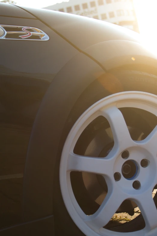 a close up of a wheel and tire of a vehicle