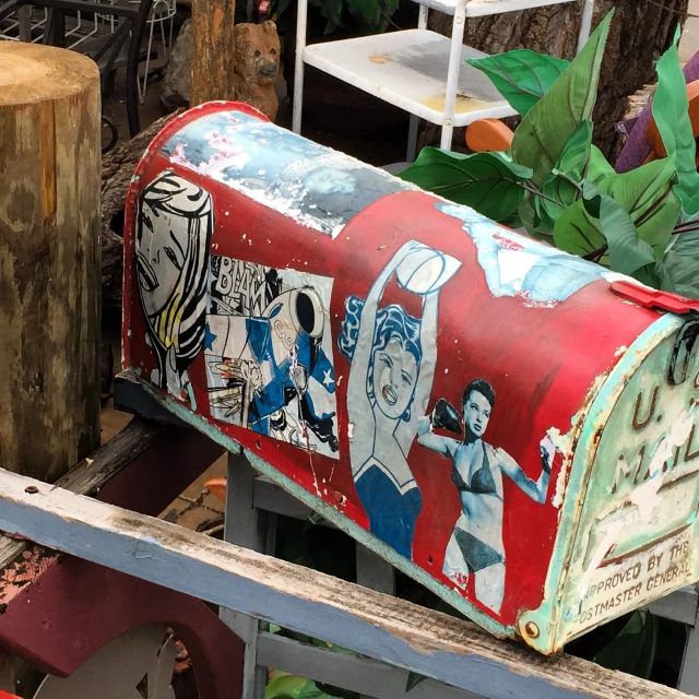 a mailbox with the painting painted on it
