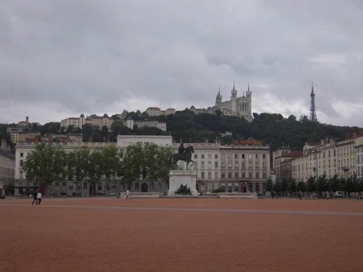 an old town with some trees and people