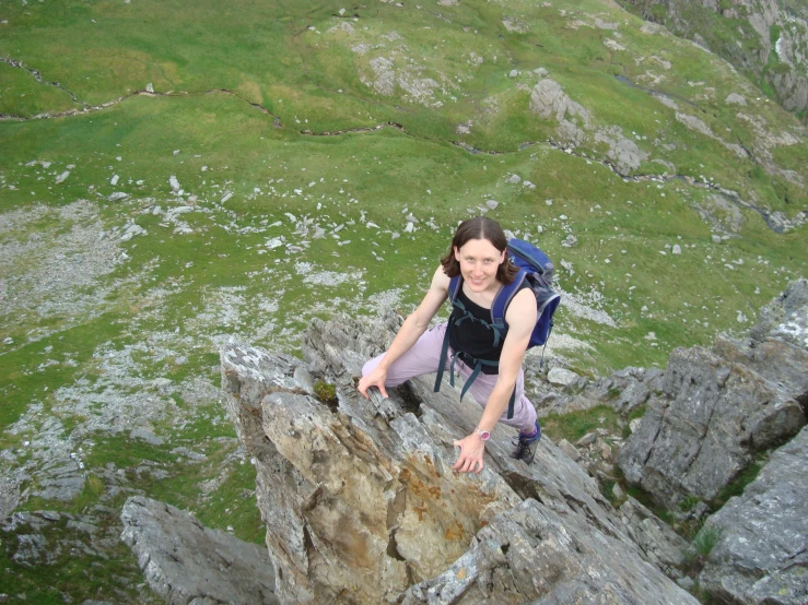 a person that is climbing up a mountain