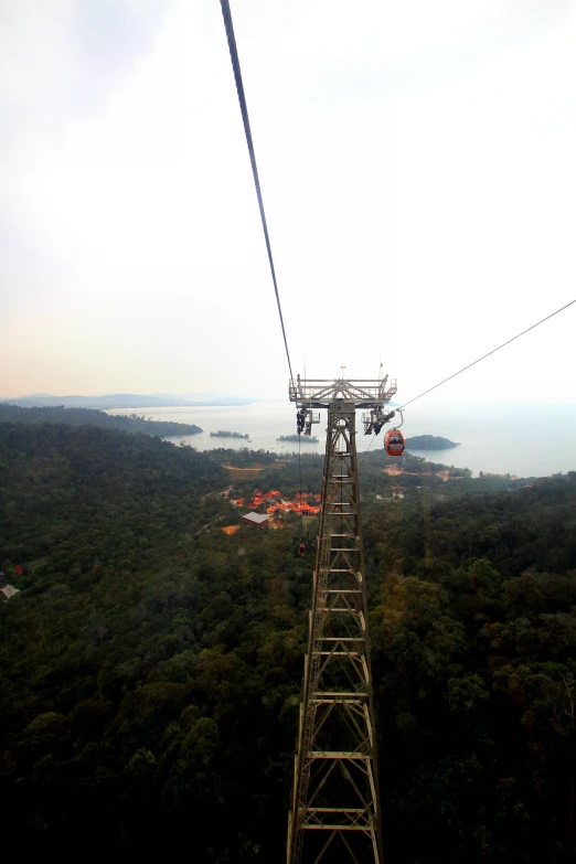 a large ropeway on a cloudy day on top of a mountain