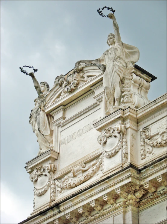 the statue is located at the top of a building