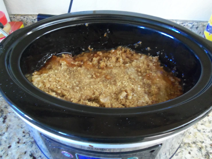 an oval bowl is filled with crock pot bread