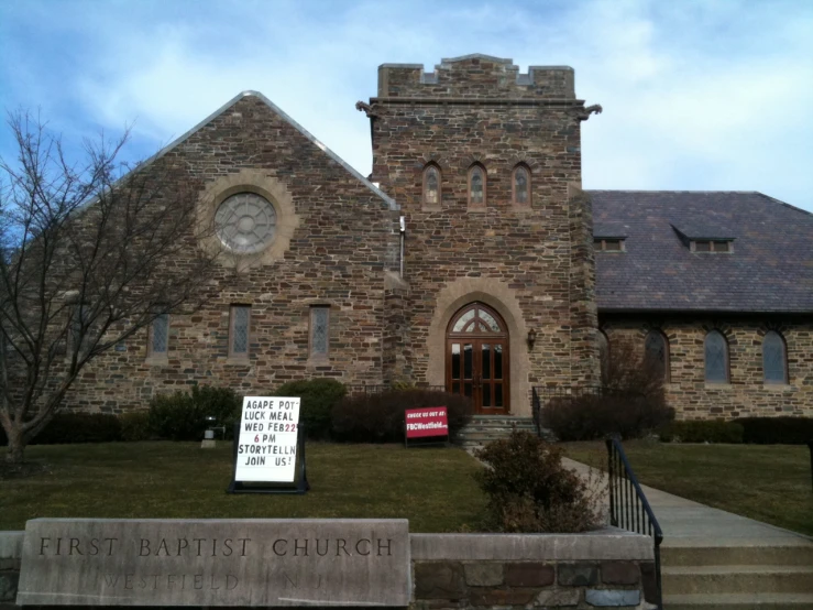 a church with signs displayed in front of it