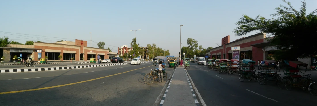 there is a lot of cars and bicycles riding on the street