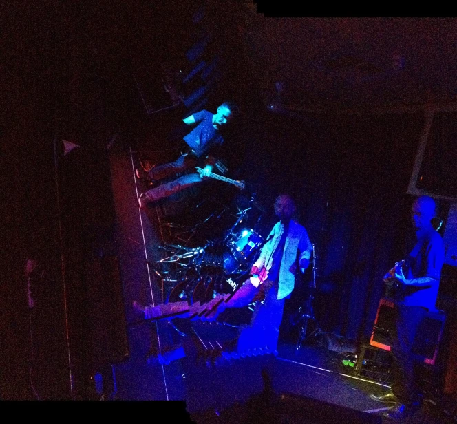 a stage in the dark, with an illuminated object