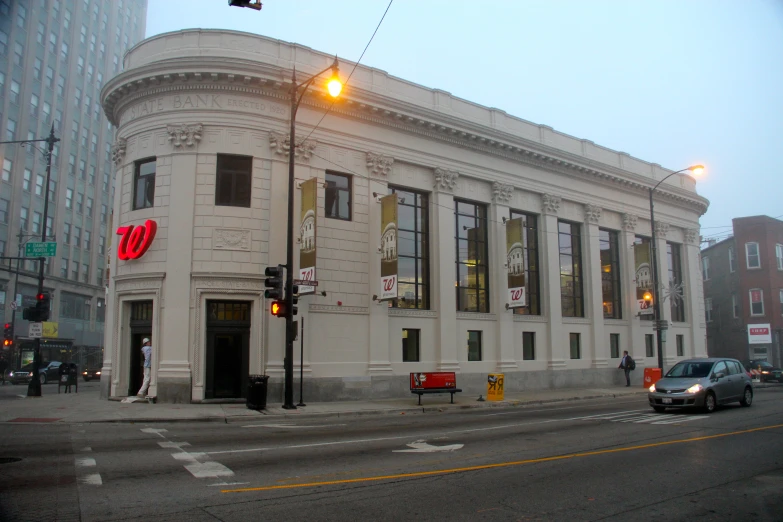 an old building stands beside an empty street